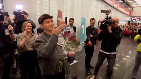 Austria's newest Eurovision winner JJ receives a hero's welcome as he lands home in Vienna