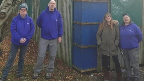 Some of the workers at Meriden Adventure Playground stand outside the storage unit in which toys and clothing was stolen