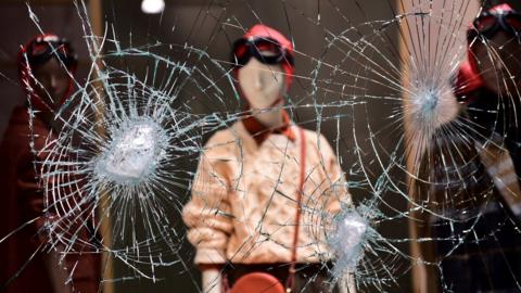 Damaged store window in Turin