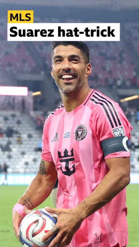 Luis Suarez smiles and celebrates goal