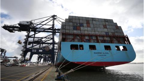 A container ship waits to be unloaded at Felixstowe port on October 17, 2013 in Felixstowe, England