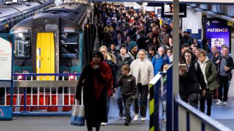 Passengers leave an Avanti West Coast train at London Euston station