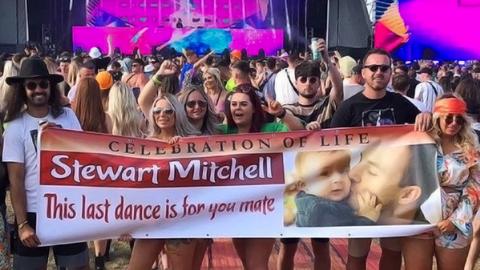 Banner held in front of stage at Creamfields