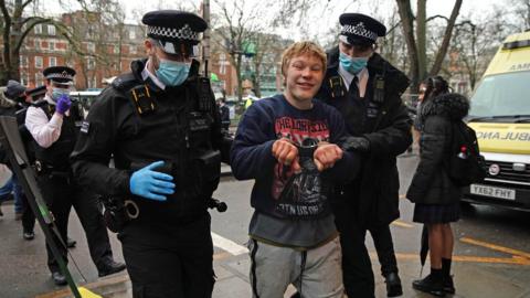 Protestor being removed by police