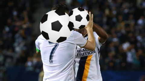 Two LA Galaxy players celebrate, their faces obscured by giant footballs