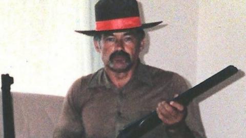 Ivan Milat, holding a gun