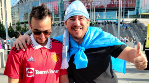 Manchester City fan Pini (right) and his friend Shai, a Manchester United fan, outside Wembley after the FA Cup final