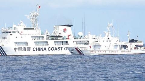 China coast guard ship blocks Philippine coast guard boat in the South China Sea