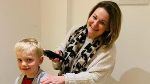 Kat Trelawny cutting her son's hair
