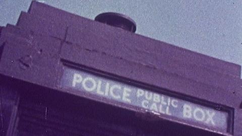 The top of a Police box, with the words 'POLICE PUBLIC CALL BOX' on a sign.