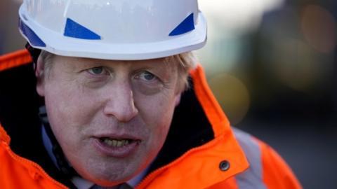 Prime Minister Boris Johnson speaks during an interview after a visit to the Tilbury Docks in Essex