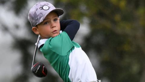 Zachary Blayney swinging a golf club