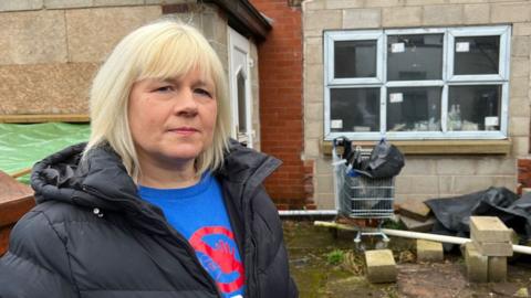 Sarah Griffiths outside her unfinished property in Bury