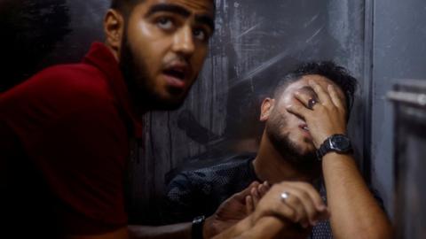 A Palestinian man reacts at a hospital in Gaza City following an explosion during a protest by the boundary wall with Israel that killed five Palestinians (13 September 2023)