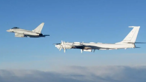 An RAF Typhon flies alongside a Russian aircraft on a previous interception