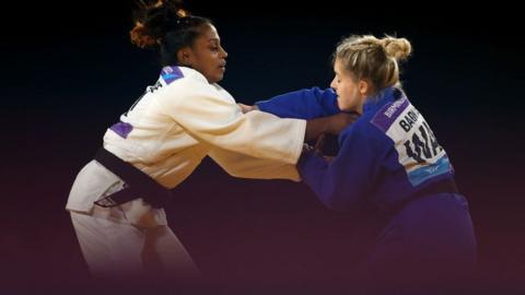 Chamila Dilani Marappulige (white) of Team Sri Lanka competes against Ashleigh-Anne Barnikel (blue) of Team Wale