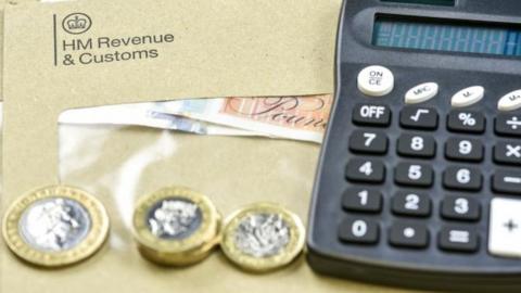 HMRC envelope, coins and calculator