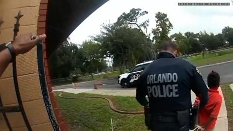 Police bodycam footage captured the moment a visibly distressed child was arrested at her school in Orlando.