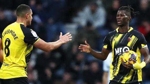 Watford's Vakoun Issouf Bayo (right) celebrates scoring their side's first goal of the game with Jake Livermore during the Sky Bet Championship match at Deepdale, Preston.