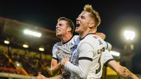 Portsmouth celebrate scoring against Barnsley.