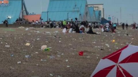 Heavy machinery is used to cope with the sheer amount of litter left on the beach.