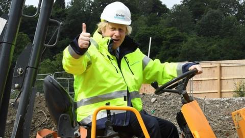 Boris Johnson on a digger during a visit to a construction site last month