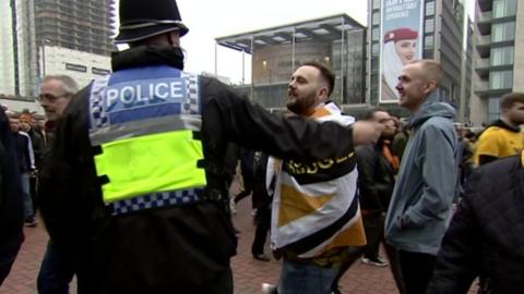 A Wolves fan receives a post-Wembley hug.