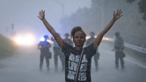 A protester is turned back by state troopers in Atlanta, 12 June