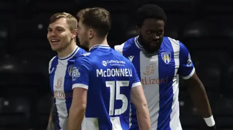 Colchester celebrate their equaliser at Notts County