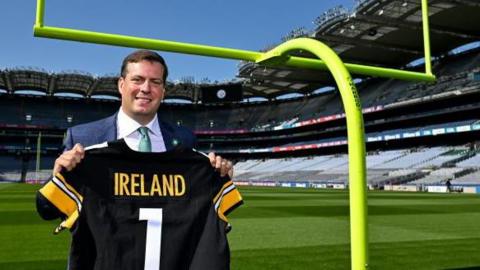 Pittsburgh Steelers executive Dan Rooney holding a Steelers jersey at Croke Park in 2023