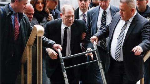 The movie producer accused of rape used a walking frame to get into the court in New York City.