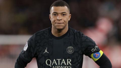 Kylian Mbappe looks on during PSG's game with Monaco