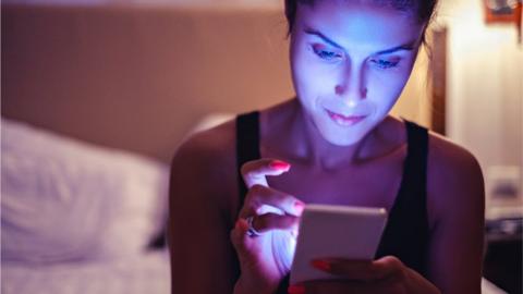 woman using her mobile phone