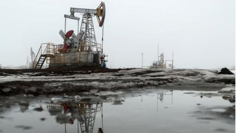 A pumpjack in operation at an oil field in Russia.