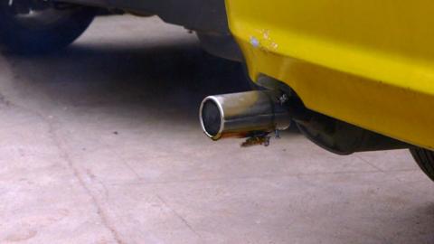 Graviky's Kaalink device attached to a car exhaust