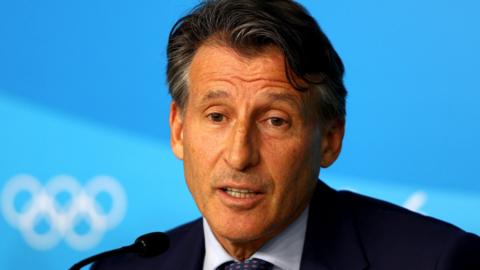 Lord Coe in front of an Olympic logo