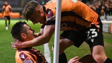 Bradford goalscorer Jamie Walker is joined in celebration by teammate Bobby Pointon 