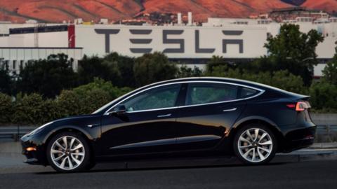 The first production model of the Tesla Model 3 out the assembly line in Fremont, California , U.S. is seen in this photo from July 10, 2017.