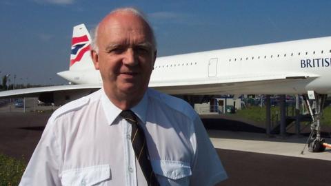 Mr Deardon beside the Concorde Alpha Foxtrot pane which he helped bring back to Bristol