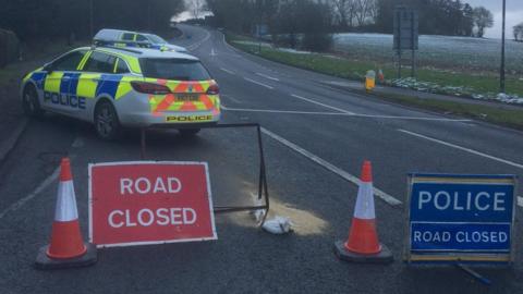 A police car by the diversion on the A40