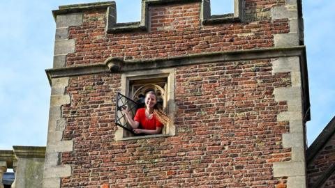 Ms Ilko looking out the tower window