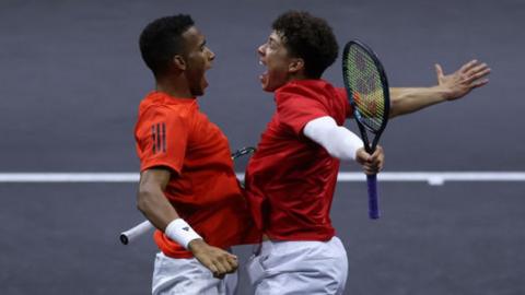 Felix Auger-Aliassime and Ben Shelton celebrate winning a doubles match in the 2023 Laver Cup
