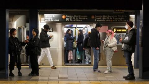 People board an F-line subway train at the Broadway-Lafayette Street station on January 28, 2023, in New York City.