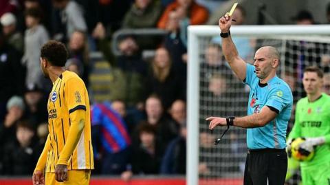 Georginio Rutter booked by referee Tim Robinson