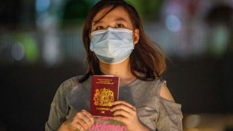 A woman in Hong Kong with her British National Overseas passport