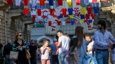 National team shirts are seen hanging up to promote Euro 2020 in Baku
