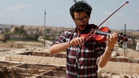 Violinist Ameen Mukdad plays in east Mosul
