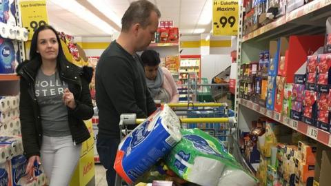 The Zedinek family, from the Czech Republic, shop in Alternberg, Germany, just across the border