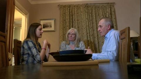 Three people sitting at a table