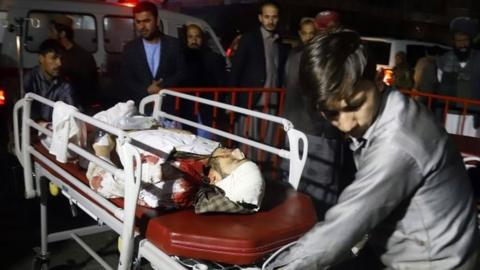 An injured person is taken to hospital in Kabul